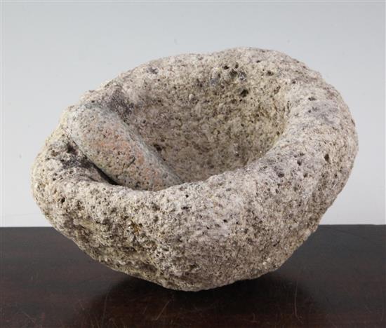 A stone pestle and mortar, believed to be bronze Age, 21cm